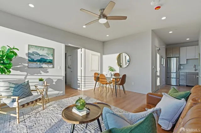 a bedroom with a bed lamp and a window