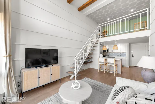 a bathroom with a sink a mirror and a shower