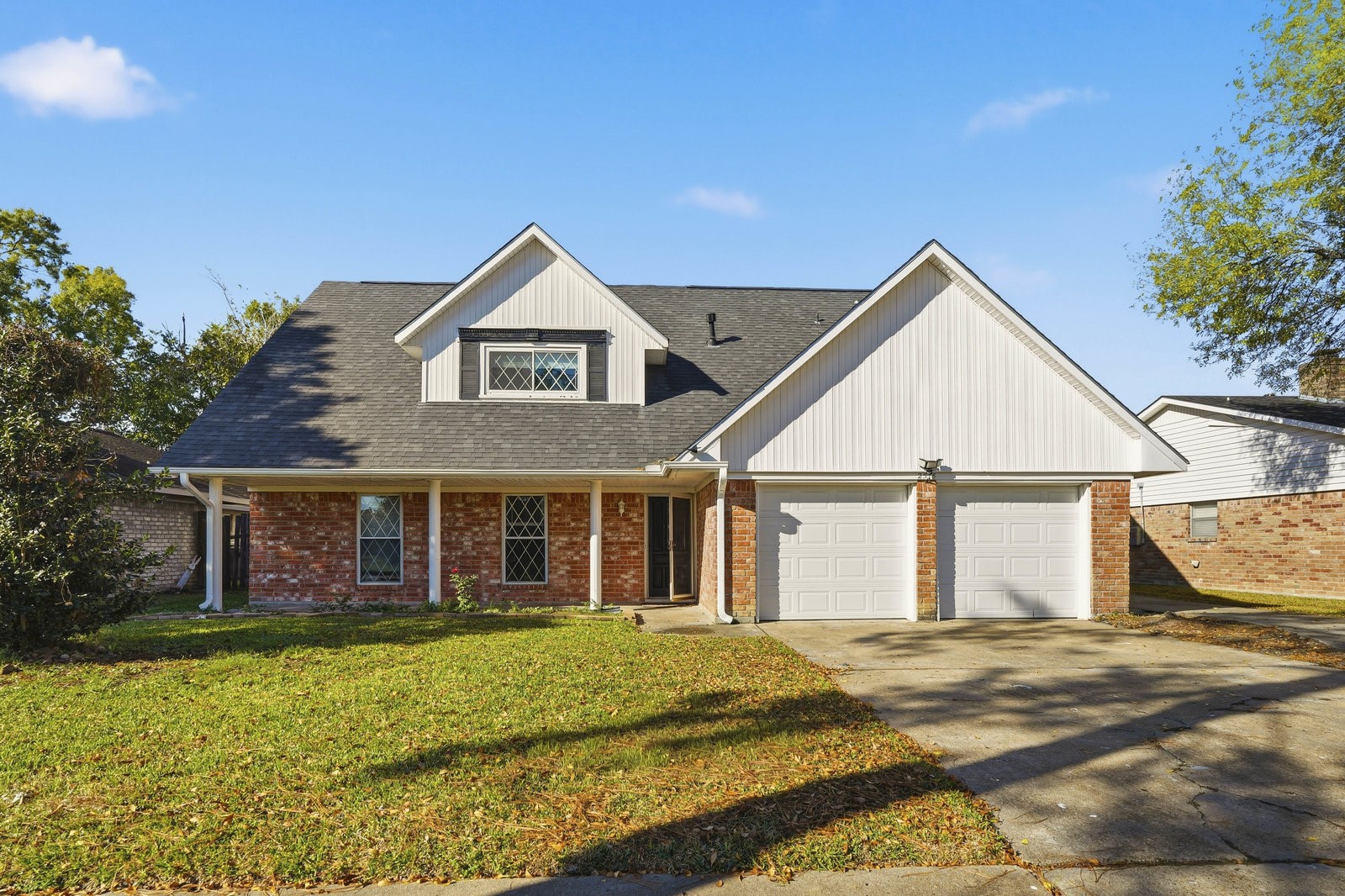 2518 Henderson Lane Deer Park, TX 77536 - Photo 1 of 28 a front view of a house with a garden