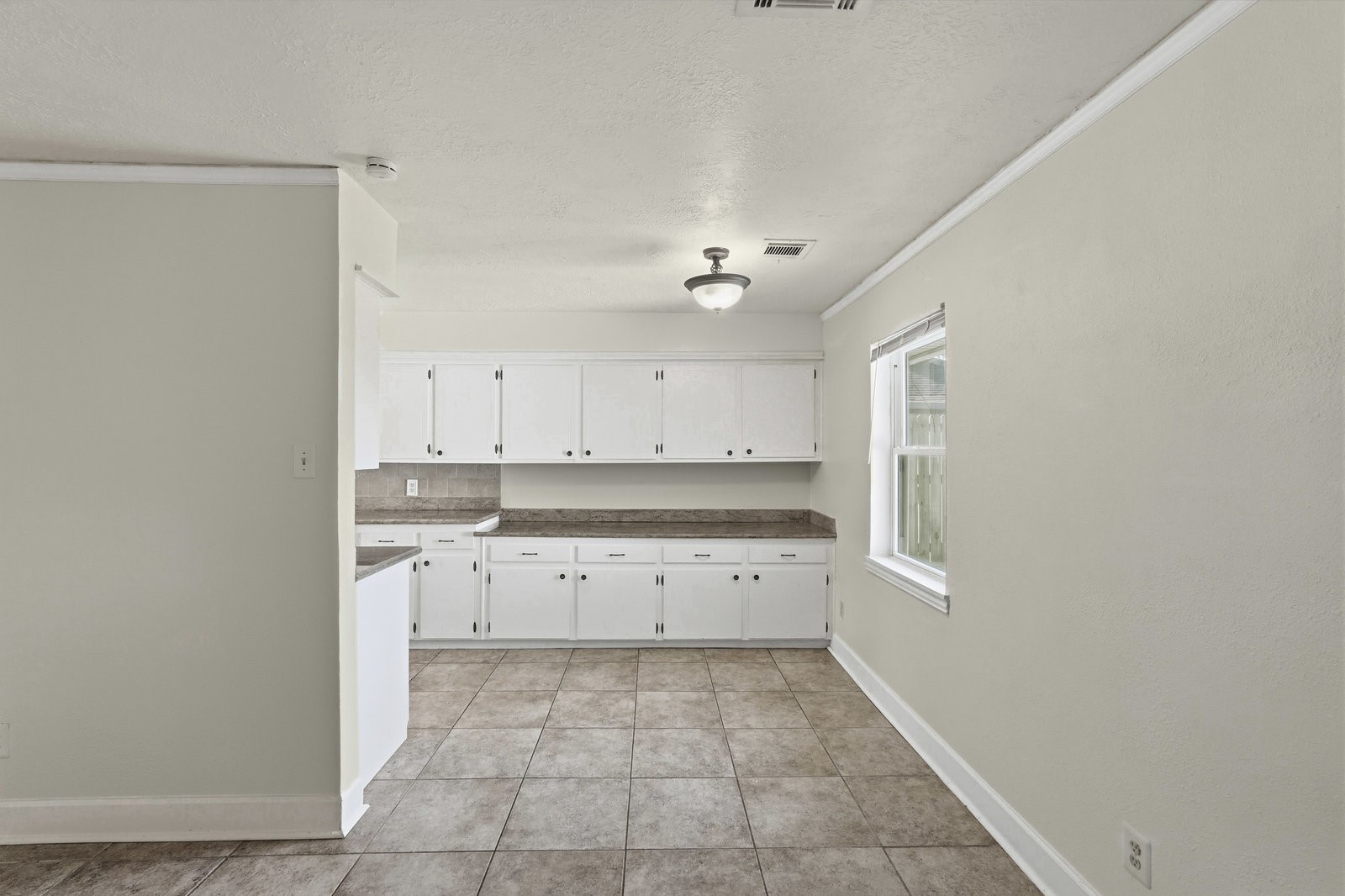 2518 Henderson Lane Deer Park, TX 77536 - Photo 11 of 28 a view of a kitchen with white cabinets