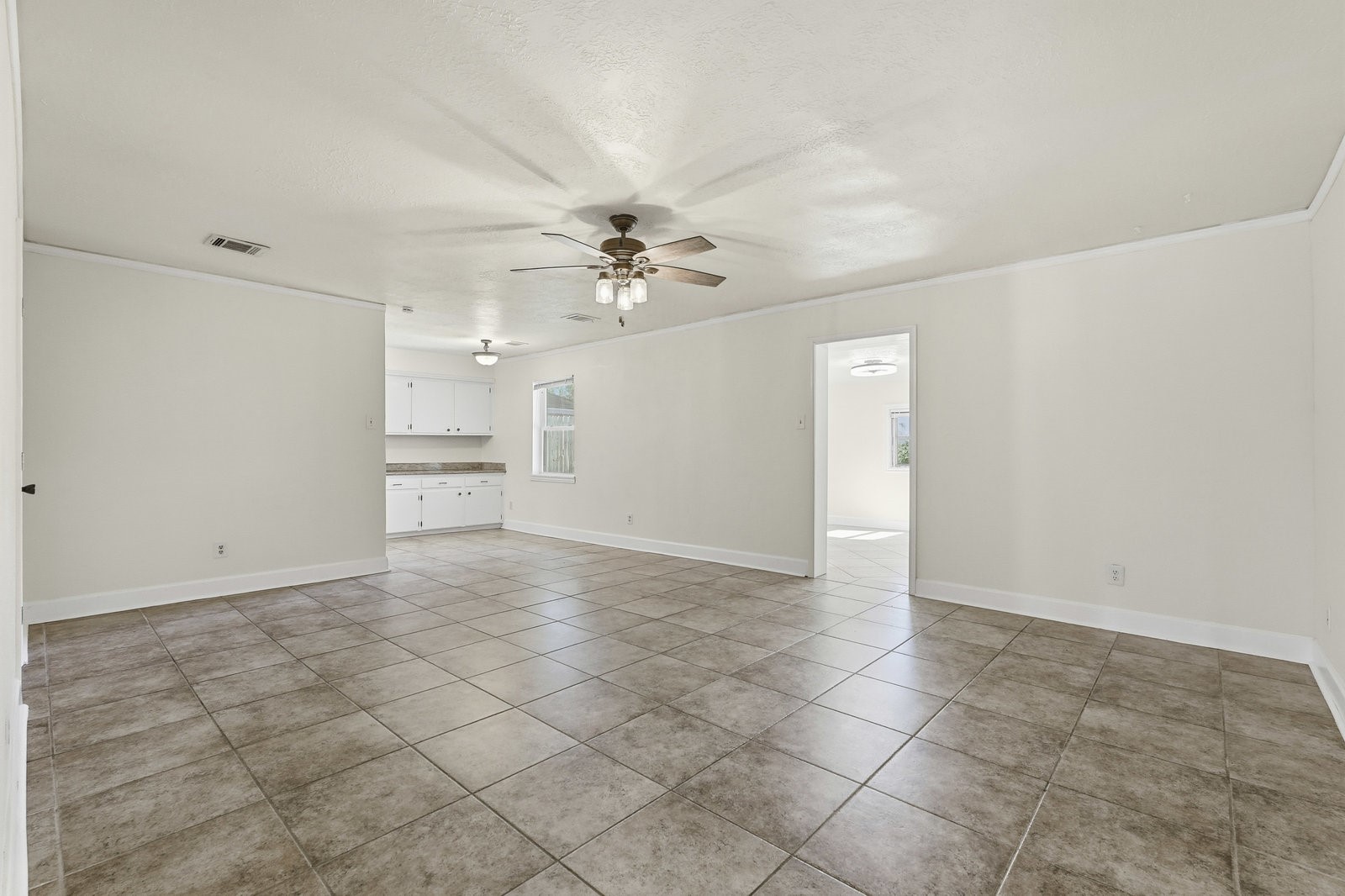 2518 Henderson Lane Deer Park, TX 77536 - Photo 13 of 28 a view of an empty room with a ceiling fan