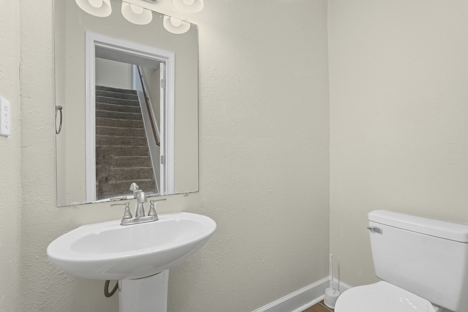 2518 Henderson Lane Deer Park, TX 77536 - Photo 14 of 28 a bathroom with a sink a toilet and mirror