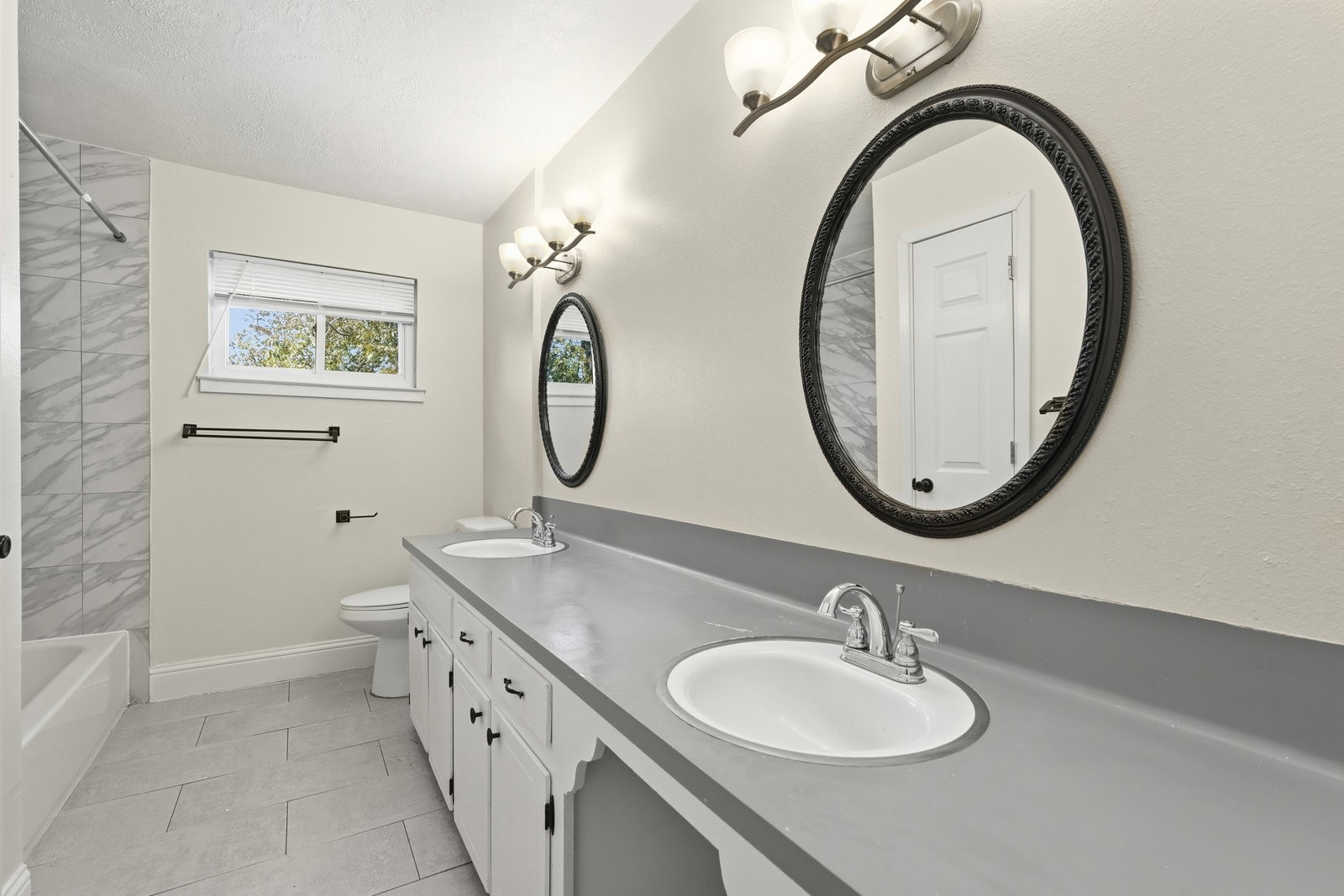 2518 Henderson Lane Deer Park, TX 77536 - Photo 25 of 28 a bathroom with a granite countertop sink and a mirror
