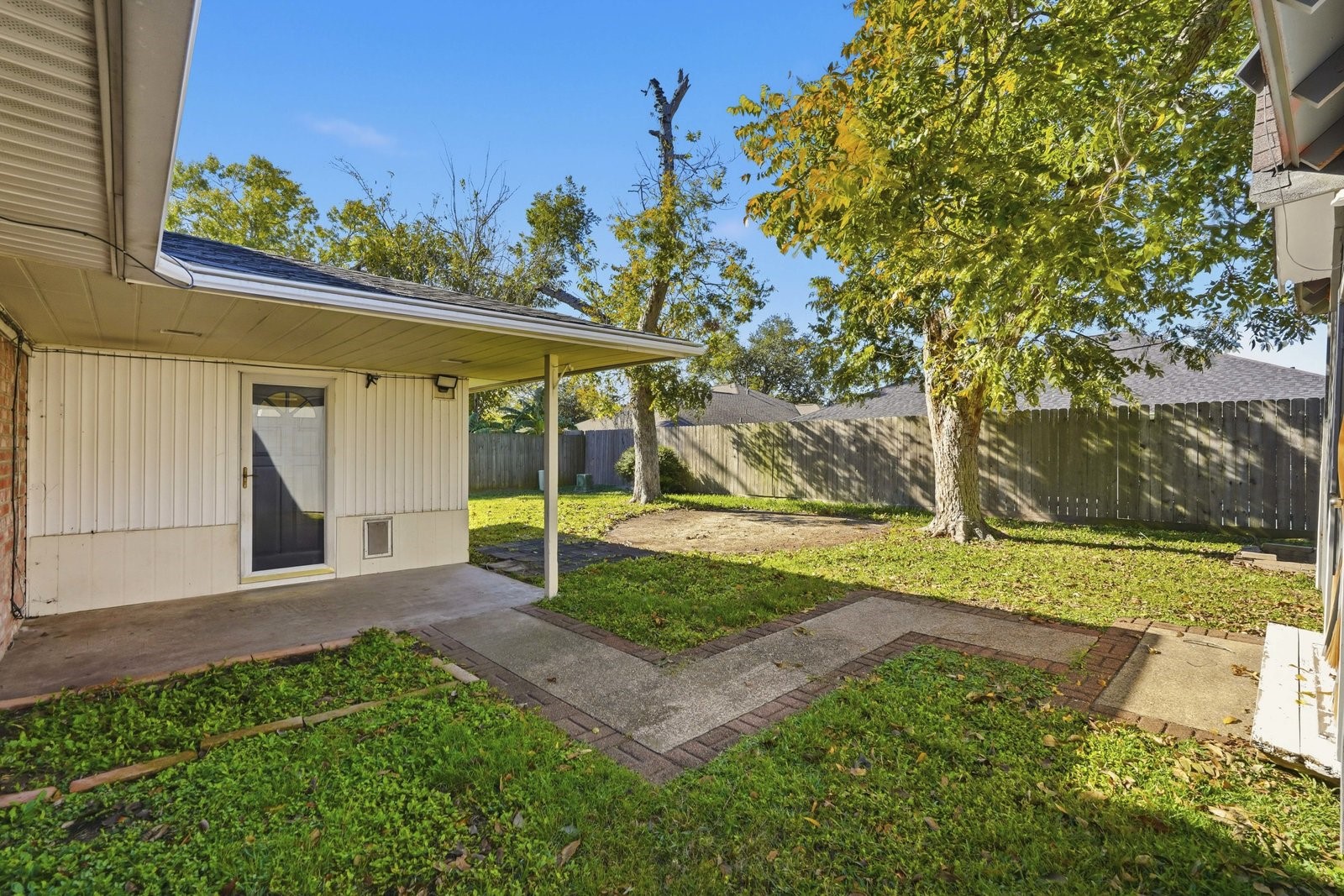 2518 Henderson Lane Deer Park, TX 77536 - Photo 28 of 28 a view of a house with backyard and a tree