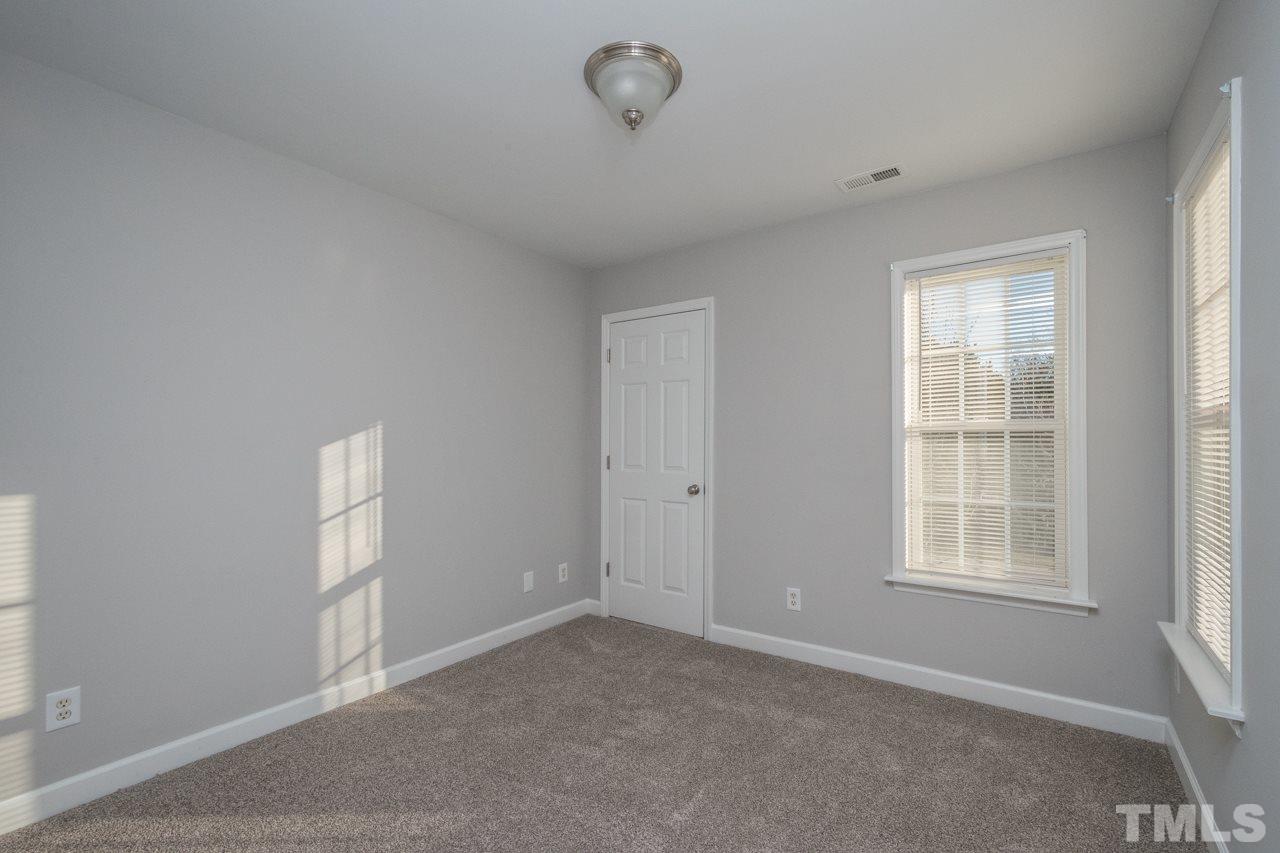 4312 Windlass Court Raleigh, NC 27616 - Photo 16 of 22 a view of an empty room with a window