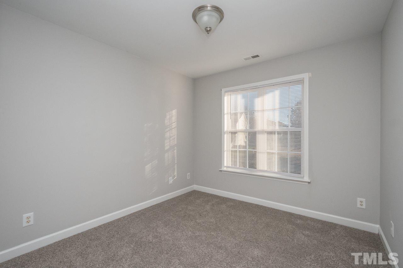4312 Windlass Court Raleigh, NC 27616 - Photo 17 of 22 an empty room with windows