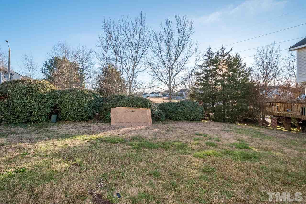 4312 Windlass Court Raleigh, NC 27616 - Photo 22 of 22 a house with trees in front of it