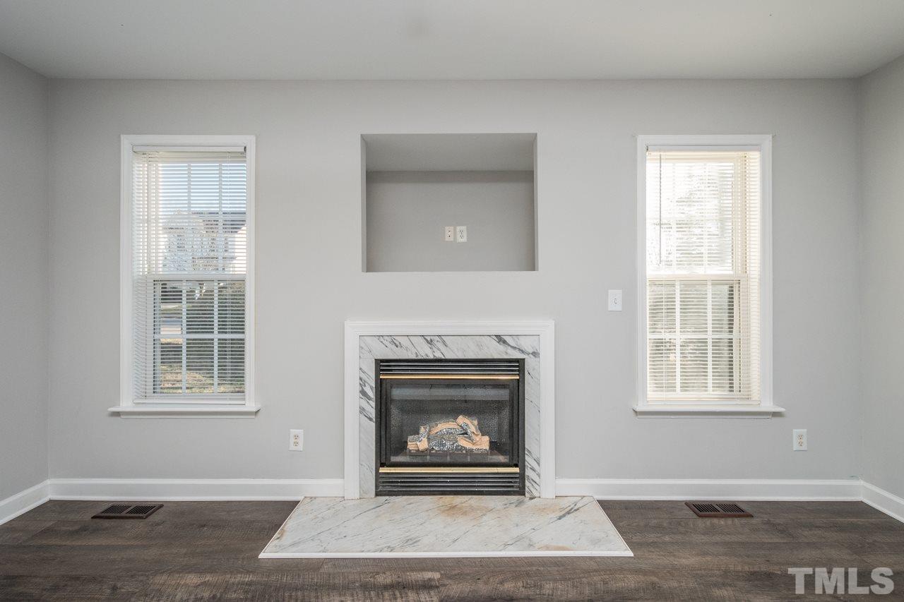 4312 Windlass Court Raleigh, NC 27616 - Photo 10 of 22 a living room with furniture and a fireplace