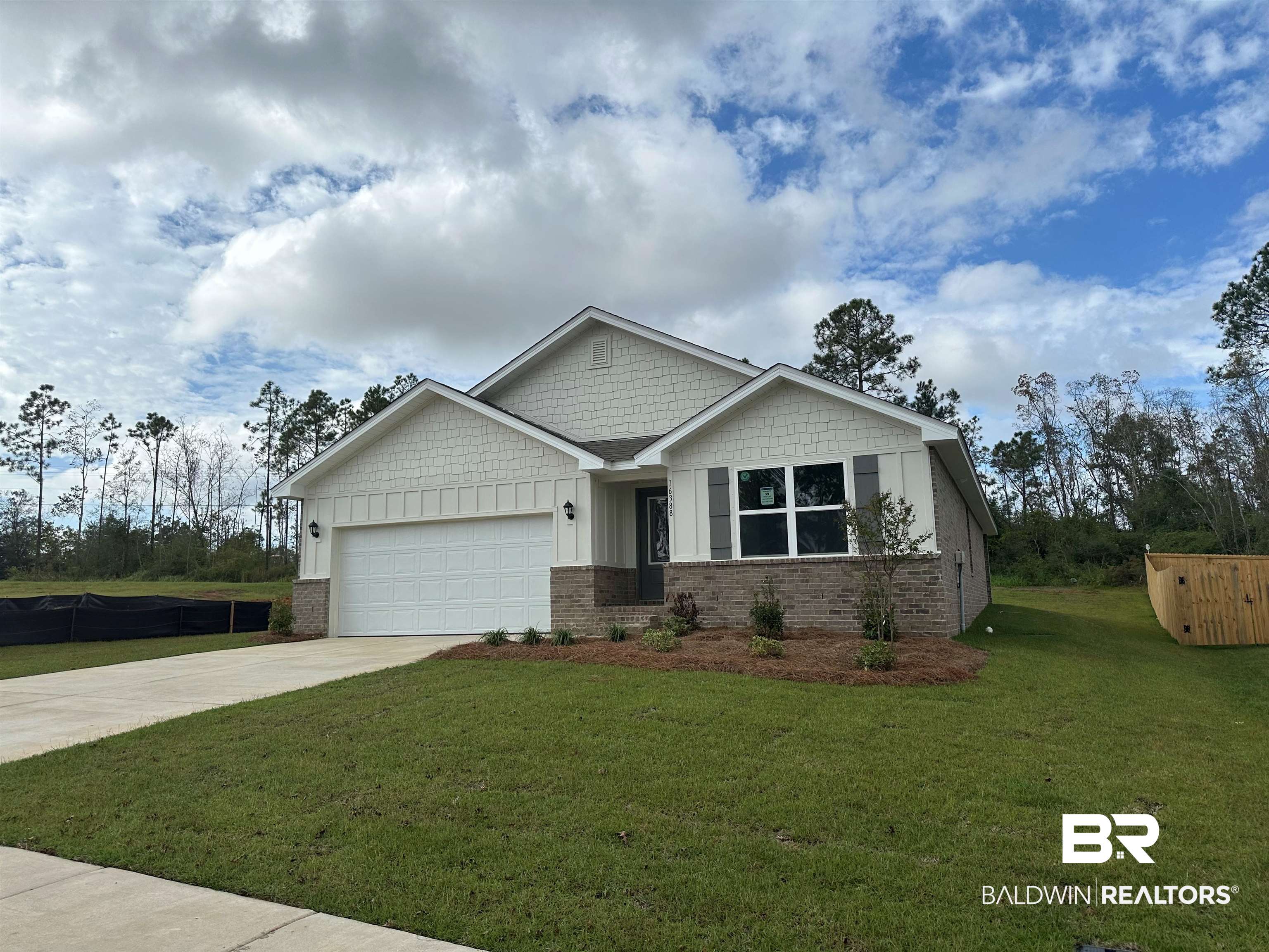 16388 Laurelbrooke Loop, Unit 39 CALI Fairhope, AL 36532 - Photo 2 of 30 Craftsman-style house featuring a garage and a front yard