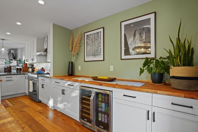 a view of a kitchen with a sink and cabinets