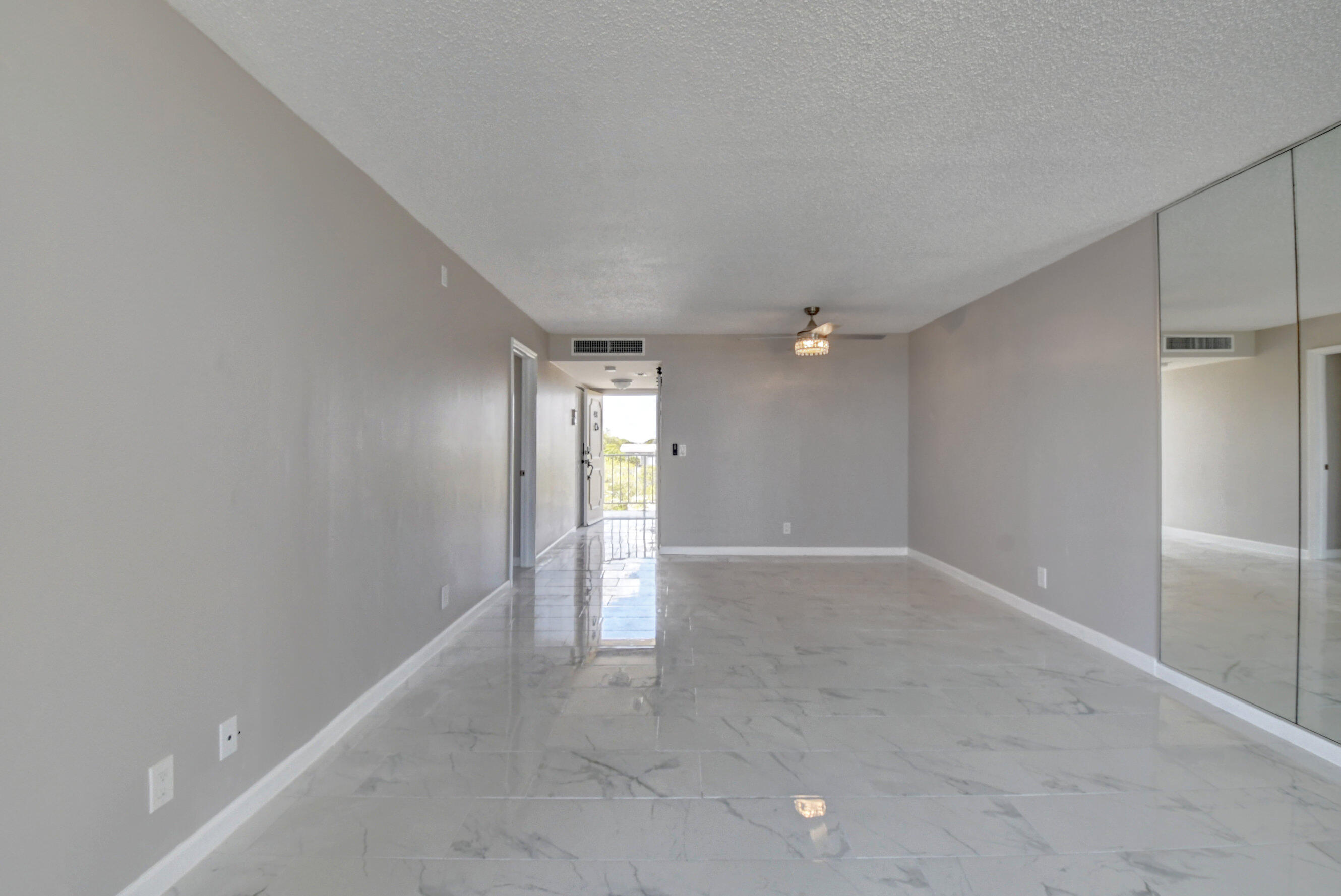5500 Northwest 2nd Avenue, Unit 418 Boca Raton, FL 33487 - Photo 12 of 43 wooden floor in an empty room with a window