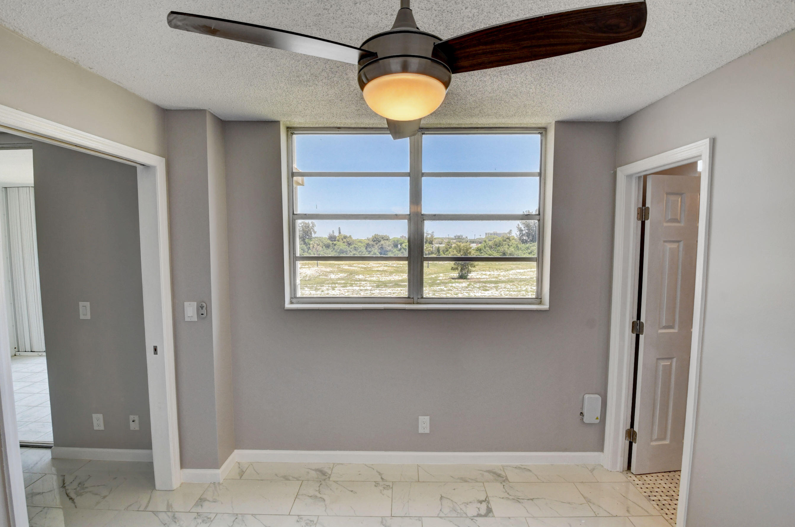 5500 Northwest 2nd Avenue, Unit 418 Boca Raton, FL 33487 - Photo 15 of 43 a lamp and window in a room