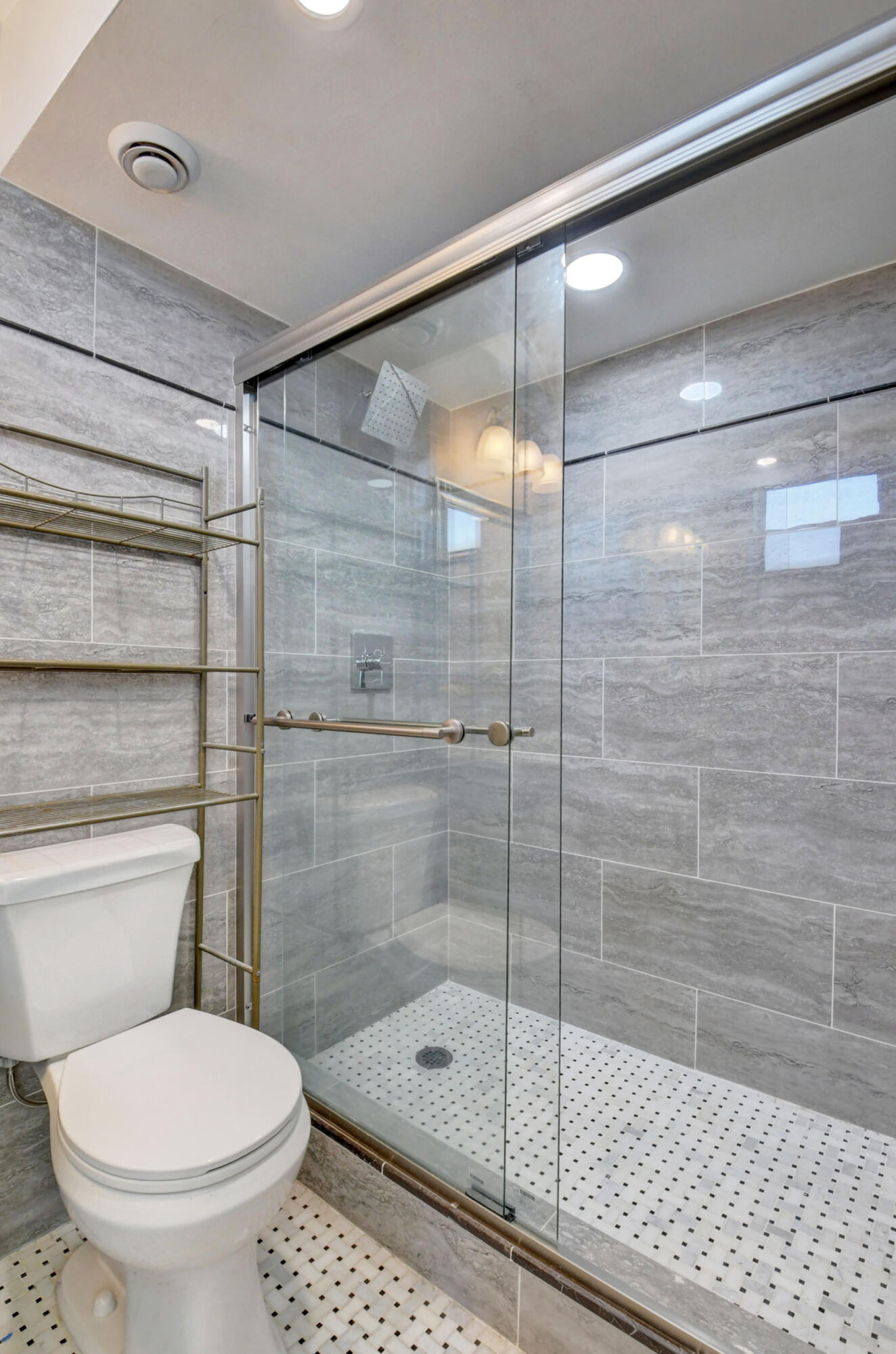 5500 Northwest 2nd Avenue, Unit 418 Boca Raton, FL 33487 - Photo 17 of 43 a bathroom with a shower and a toilet
