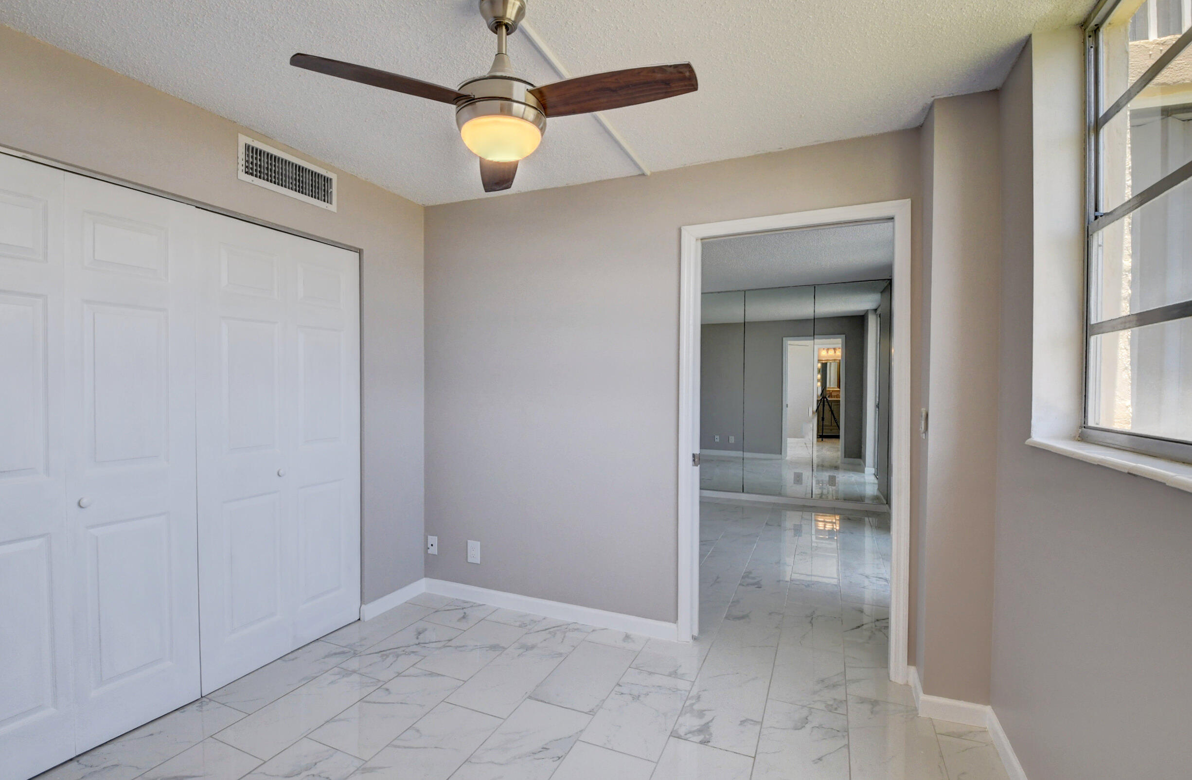 5500 Northwest 2nd Avenue, Unit 418 Boca Raton, FL 33487 - Photo 18 of 43 a view of an empty room with a window