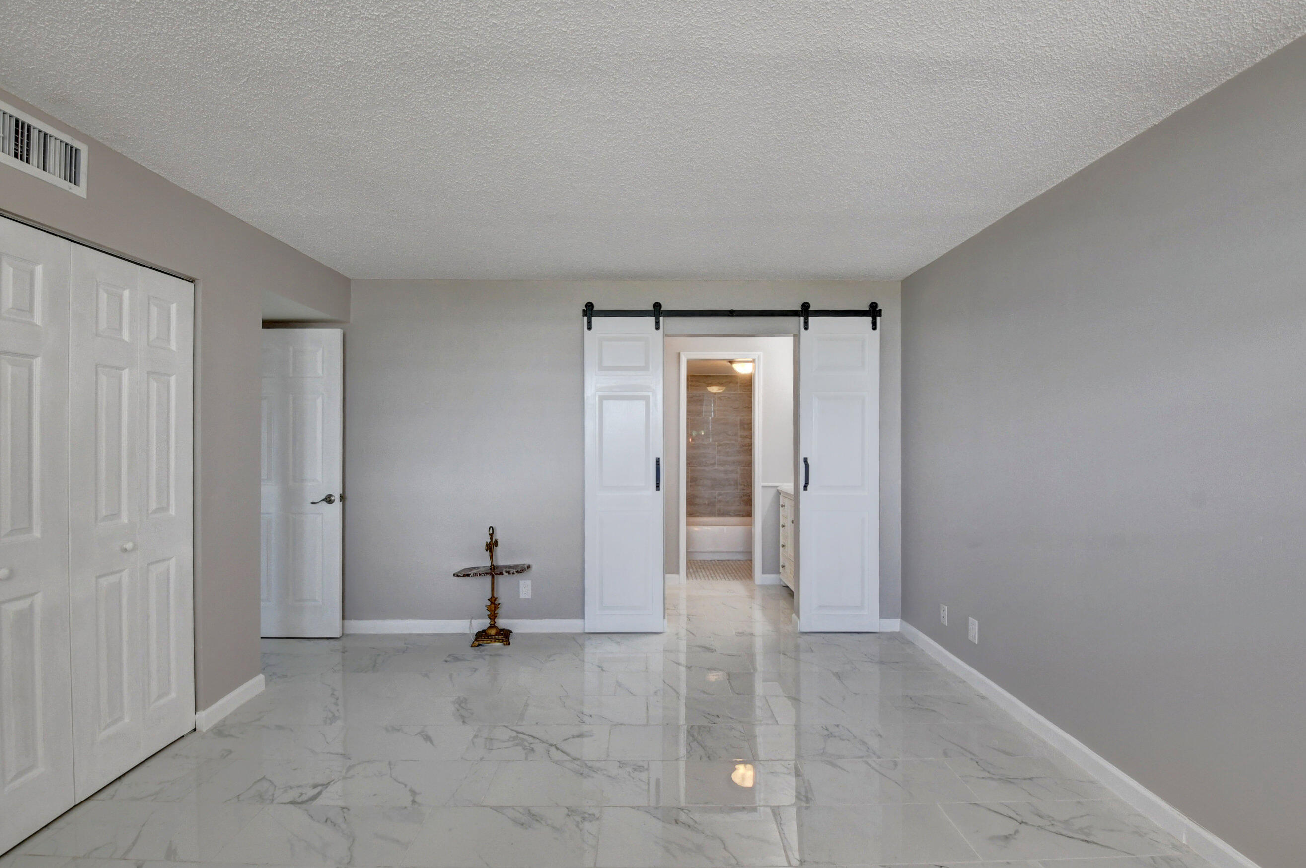 5500 Northwest 2nd Avenue, Unit 418 Boca Raton, FL 33487 - Photo 21 of 43 a view of a livingroom and a mirror