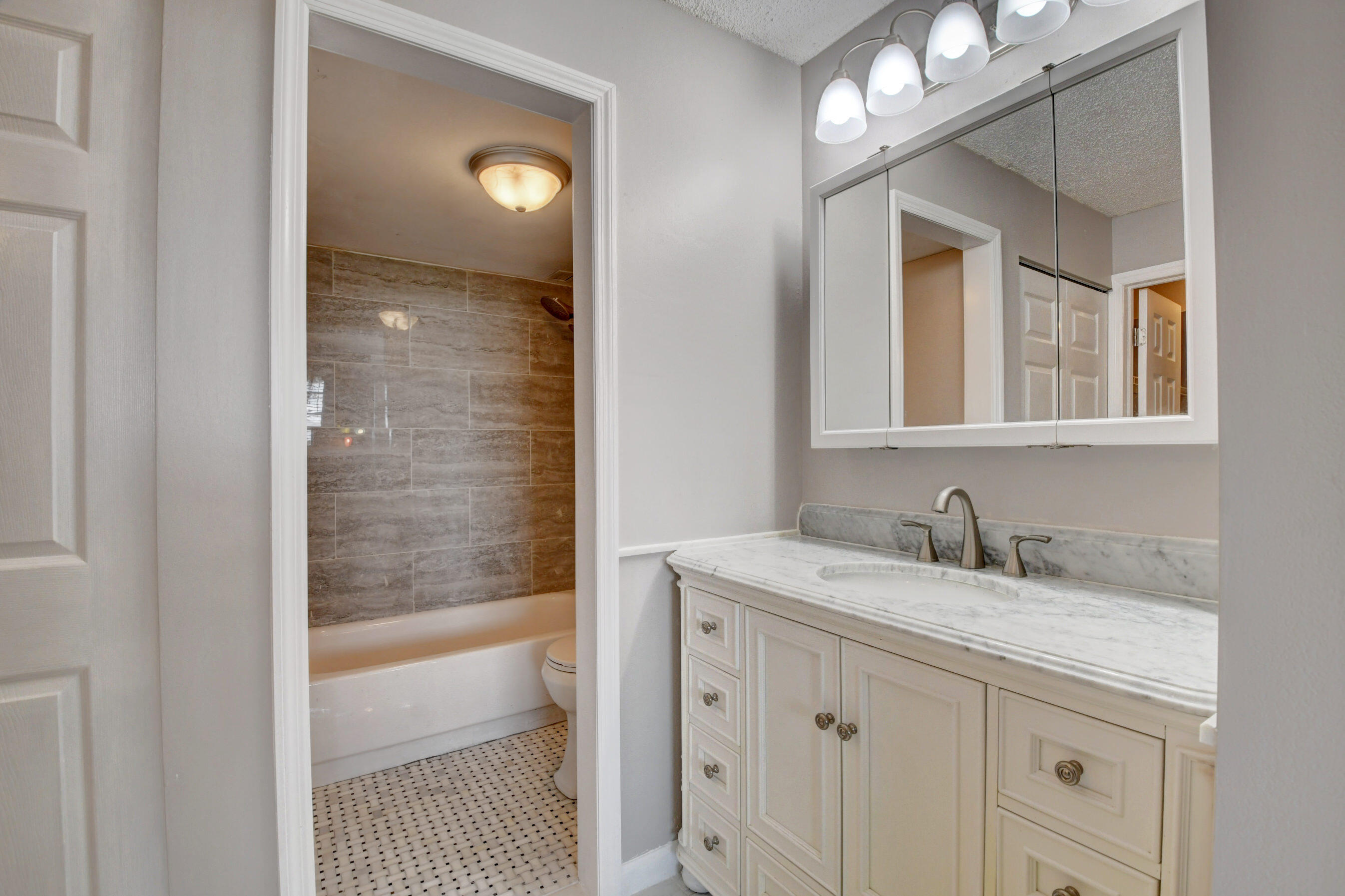 5500 Northwest 2nd Avenue, Unit 418 Boca Raton, FL 33487 - Photo 24 of 43 a bathroom with a sink and a mirror