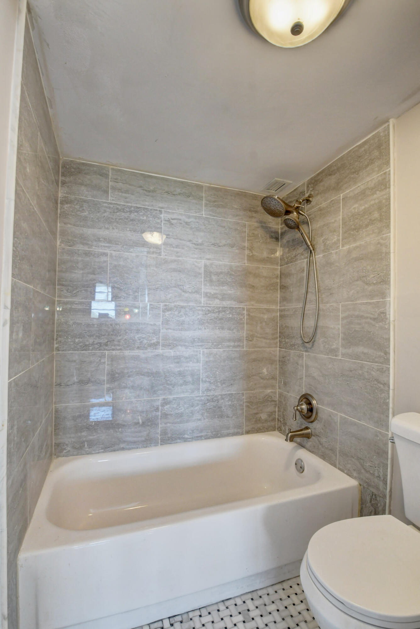 5500 Northwest 2nd Avenue, Unit 418 Boca Raton, FL 33487 - Photo 25 of 43 a bathroom with a bathtub and a toilet