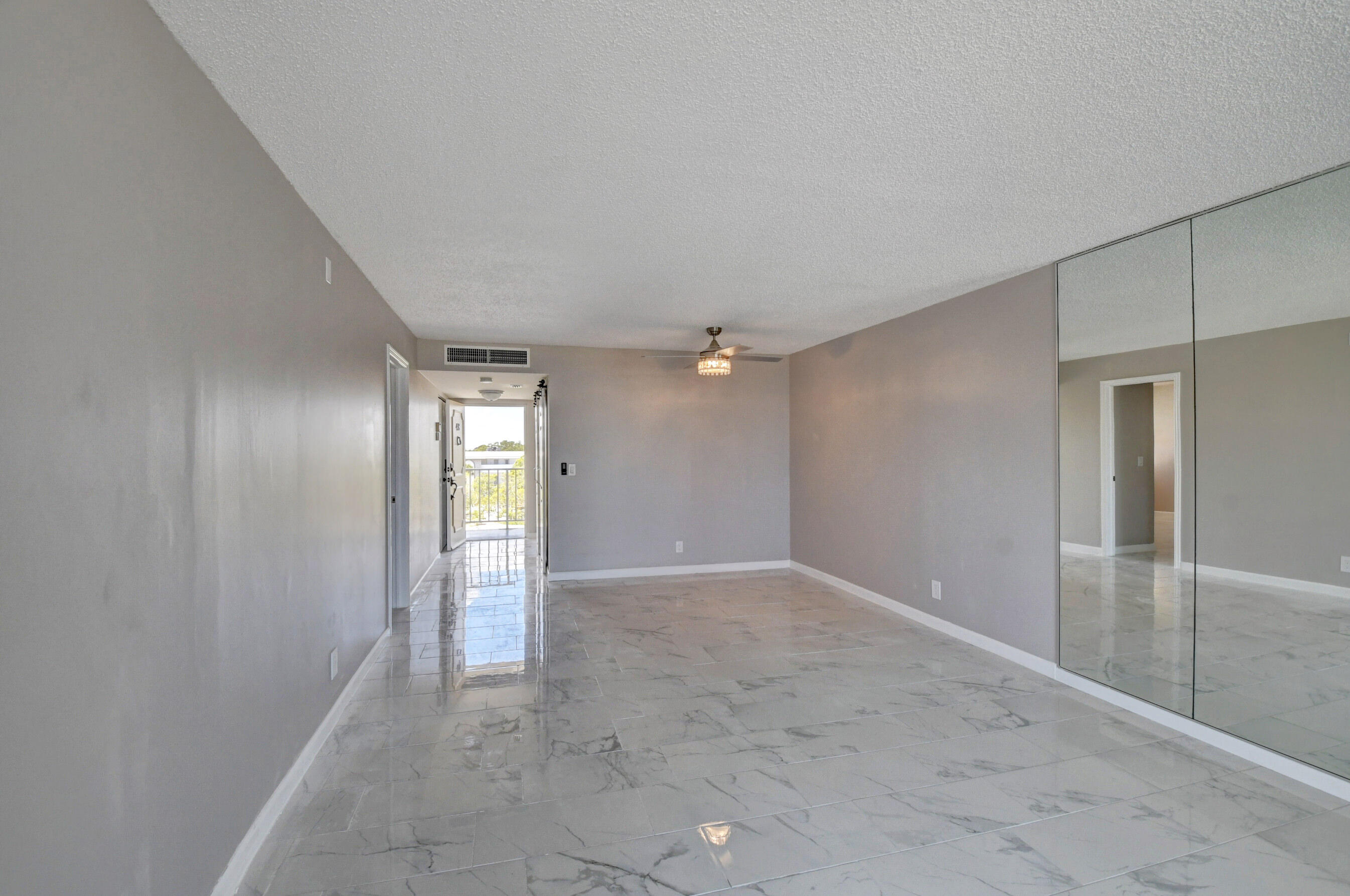 5500 Northwest 2nd Avenue, Unit 418 Boca Raton, FL 33487 - Photo 28 of 43 an empty room with windows and closet
