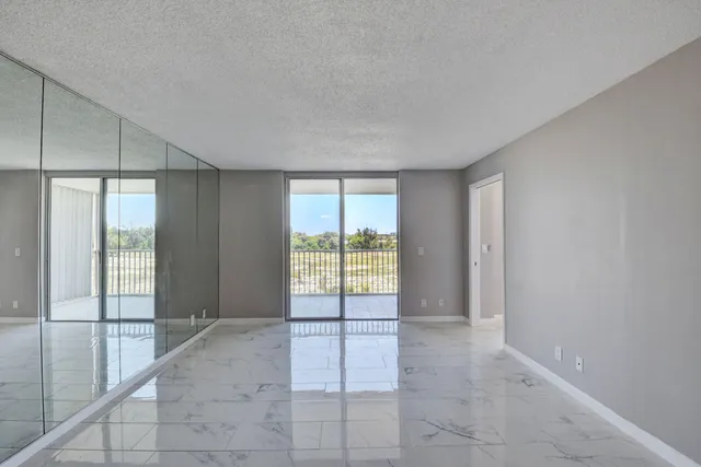 a view of an empty room and window
