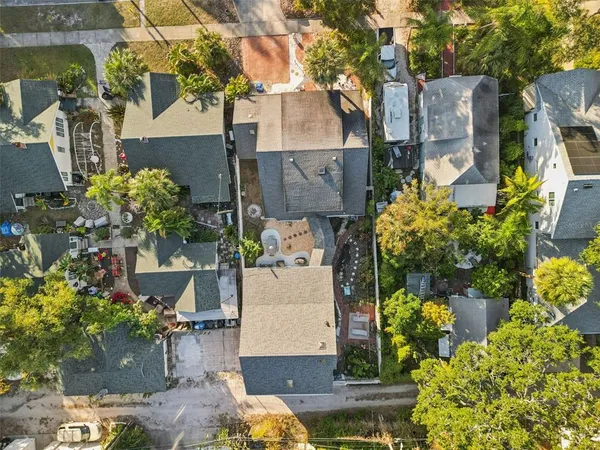 a aerial view of a house with a yard and garden