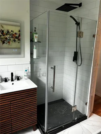a white bath tub sitting next to a white sink