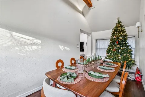 a kitchen with stainless steel appliances granite countertop a refrigerator a sink a stove and dishwasher