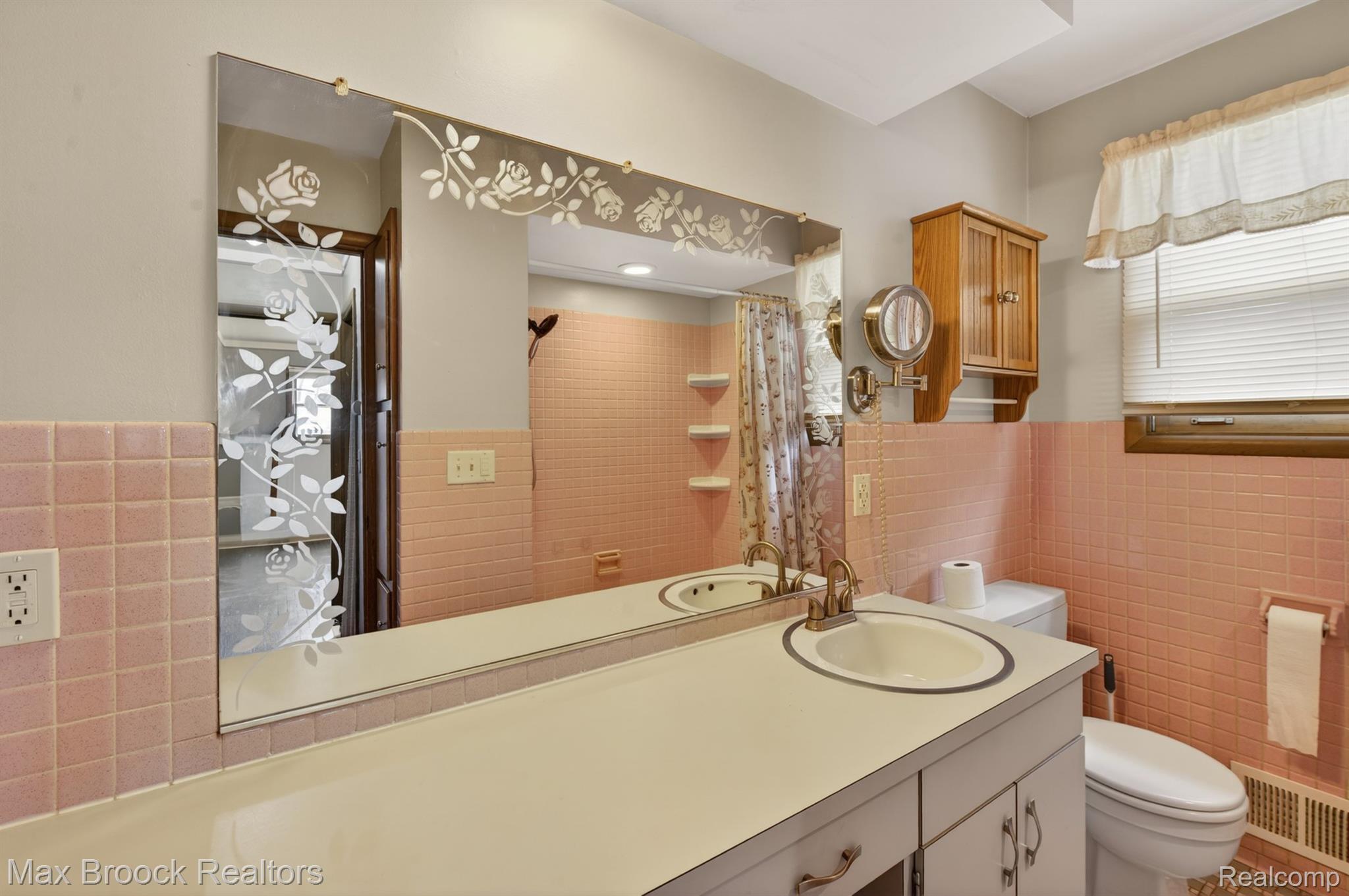 9024 Mandon Road White Lake, MI 48386 - Photo 16 of 39 Bathroom with tile walls, vanity, a wainscoted wall, and curtained shower