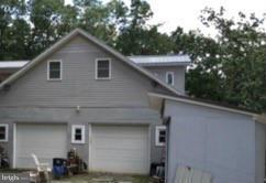 1044 Spielman Road Berkeley Springs, WV 25411 - Photo 2 of 25 a house view with a outdoor space