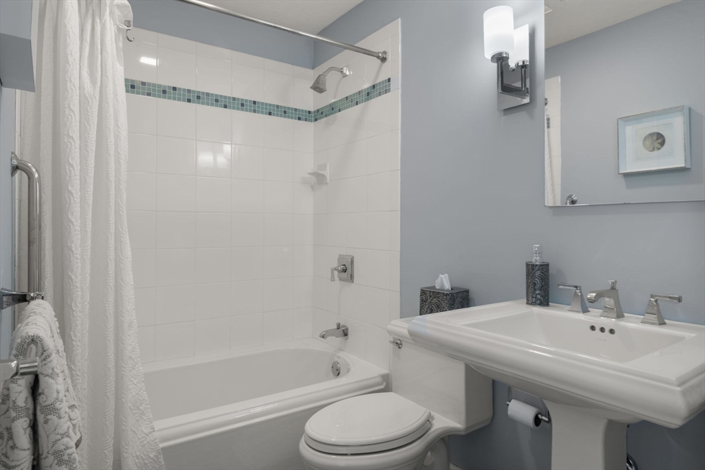 66 Glades Road, Unit 8 Scituate, MA 02066 - Photo 22 of 27 a bathroom with a sink toilet and shower