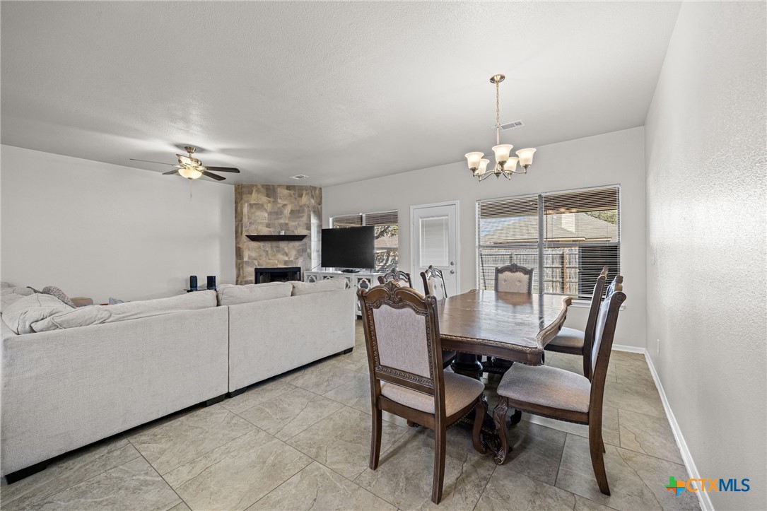4712 Ramhorn Killeen, TX 76542 - Photo 3 of 27 a view of a dining room with furniture and chandelier