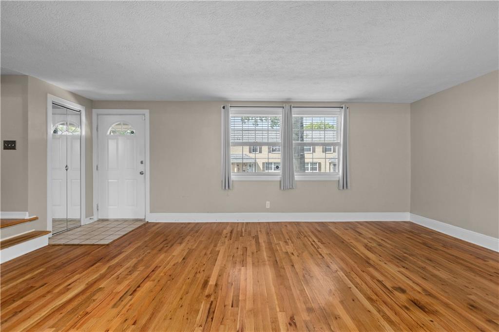 109 Raleigh Court Pittsburgh, PA 15237 - Photo 13 of 21 a view of an empty room with wooden floor and a window