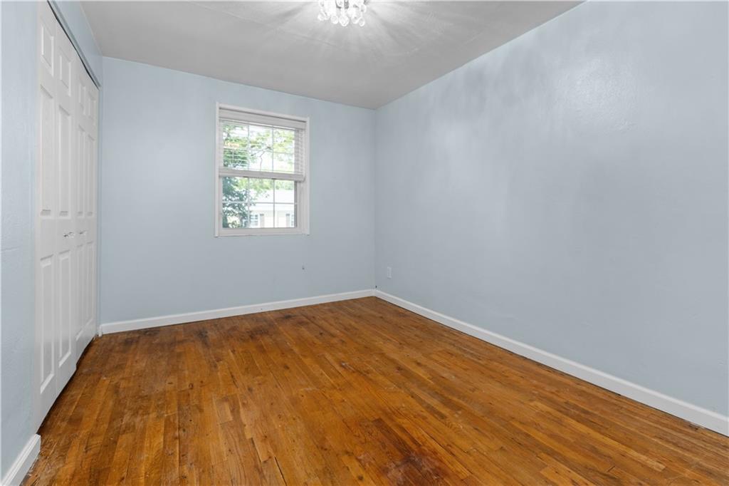 109 Raleigh Court Pittsburgh, PA 15237 - Photo 17 of 21 a view of empty room with wooden floor and fan