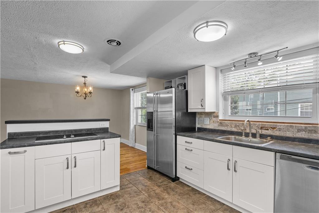 109 Raleigh Court Pittsburgh, PA 15237 - Photo 9 of 21 a kitchen with stainless steel appliances granite countertop a sink stove and refrigerator