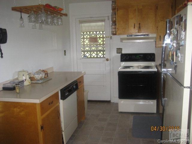2419 Byrd Road Morganton, NC 28655 - Photo 3 of 19 a kitchen with a stove and a refrigerator