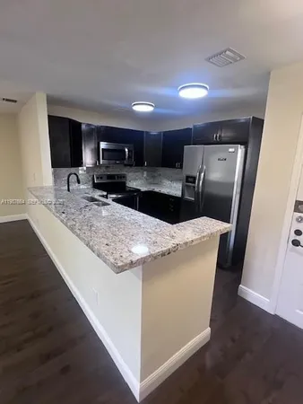 a view of living room with furniture and flat screen tv