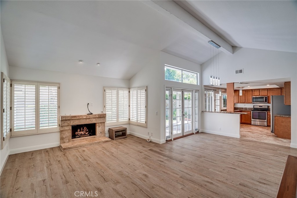 49 East Yale Loop, Unit 26 Irvine, CA 92604 - Photo 5 of 63 an empty room with furniture and wooden floor
