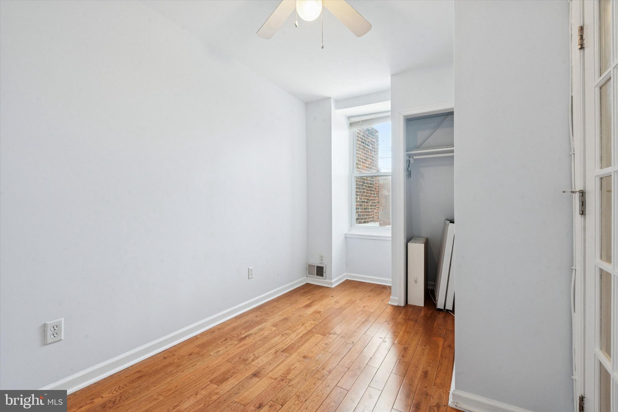 102 Daly Street Philadelphia, PA 19148 - Photo 17 of 25 an empty room with a bathroom and a hallway