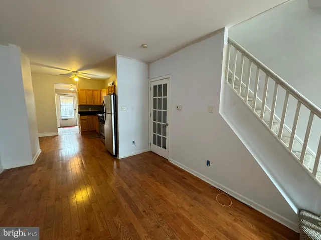 a view of a hallway view with wooden floor and furniture