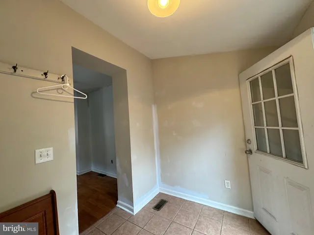 a view of storage and utility room with closet