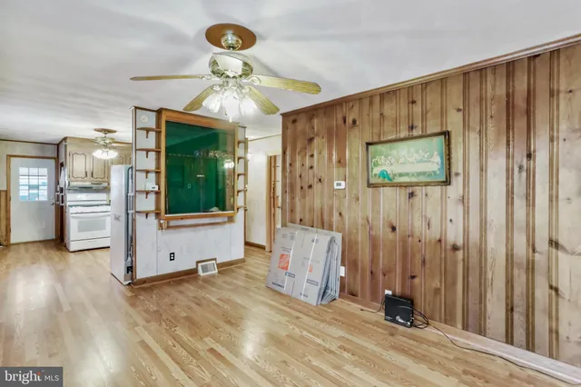 wooden floor in an empty room and a window