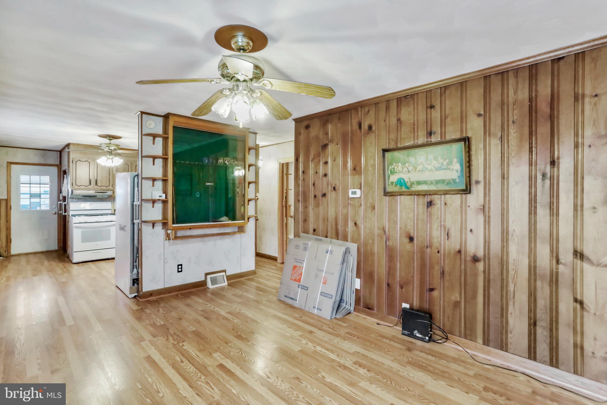 208 Fulton Street Hancock, MD 21750 - Photo 13 of 33 wooden floor in an empty room and a window