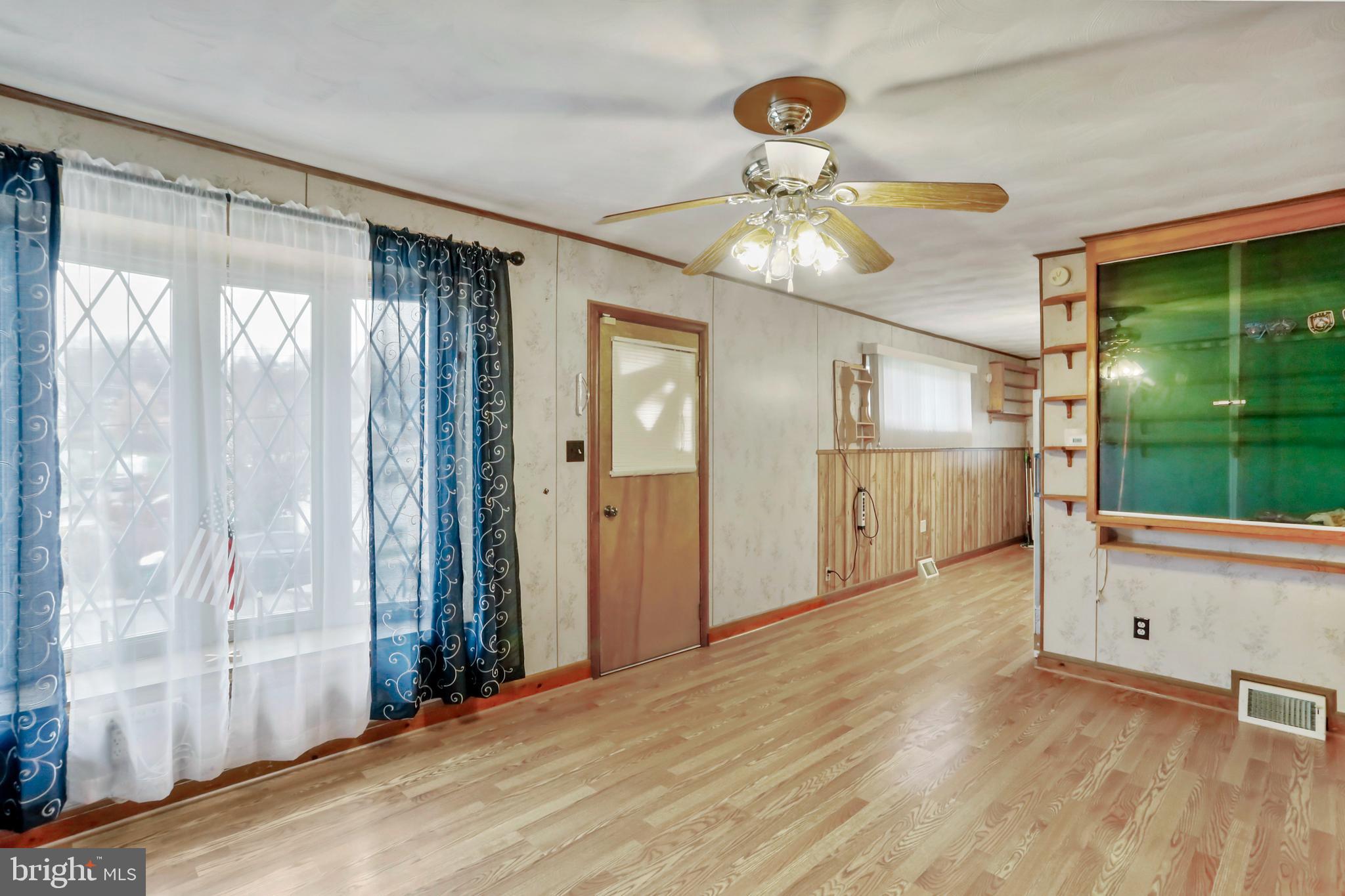 208 Fulton Street Hancock, MD 21750 - Photo 14 of 33 a view of an empty room with a window
