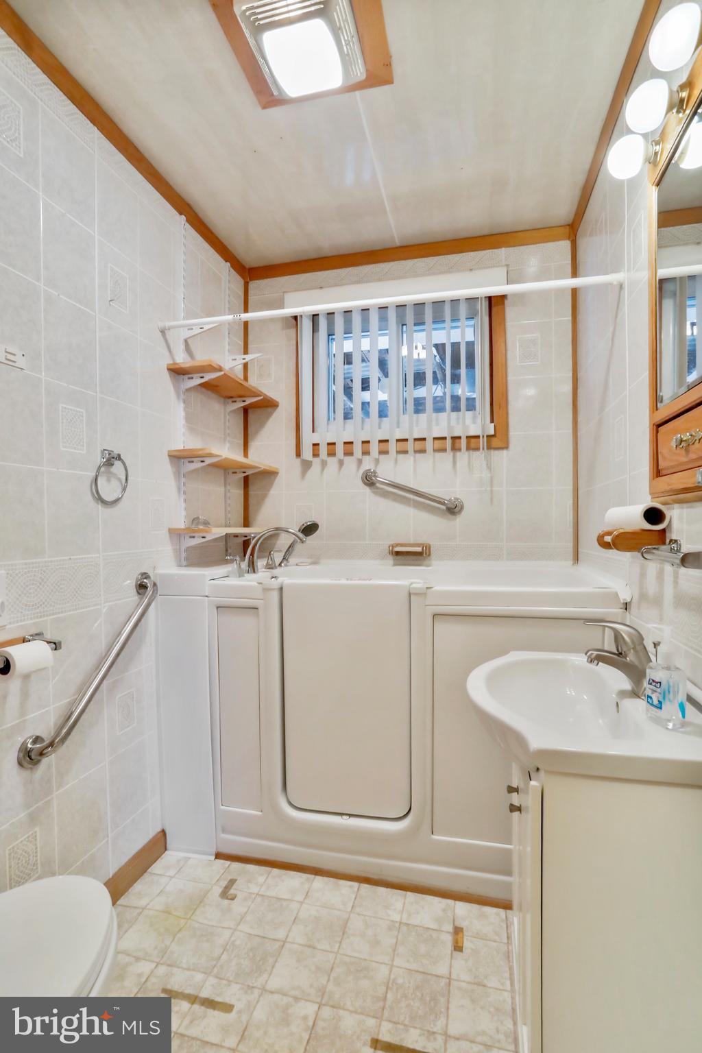 208 Fulton Street Hancock, MD 21750 - Photo 18 of 33 a bathroom with a sink a toilet and shower