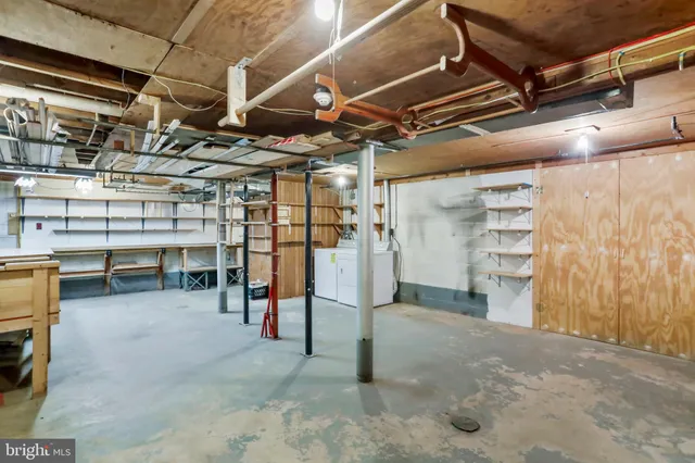 a view of empty room with wooden ceiling