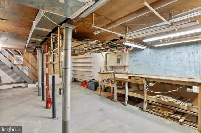 a view of an empty room with wooden walls