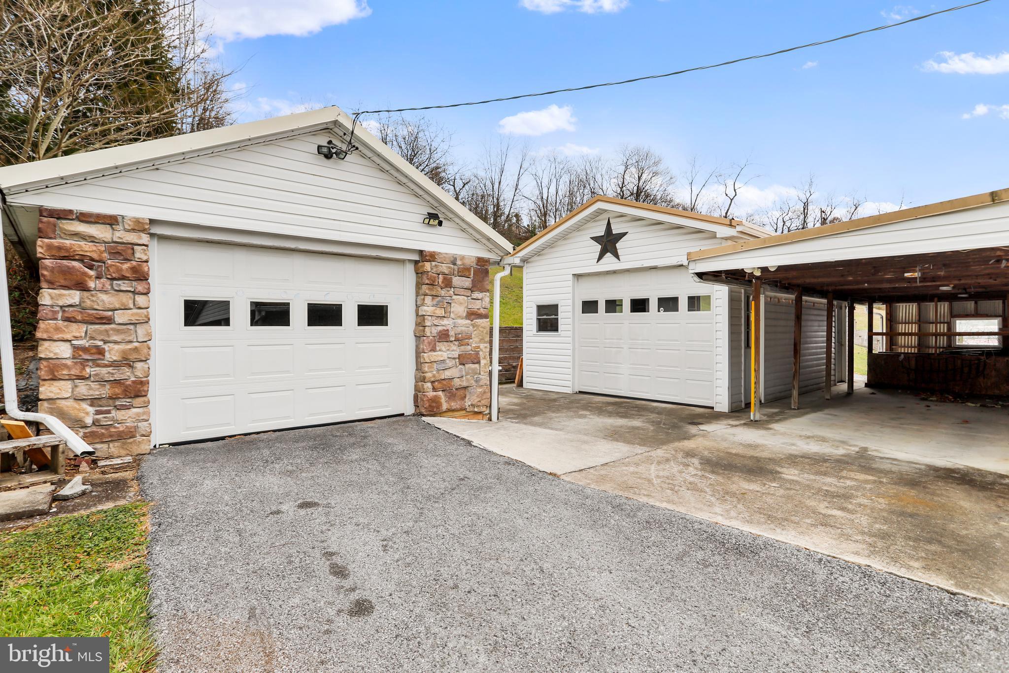 208 Fulton Street Hancock, MD 21750 - Photo 28 of 33 a view of a white house with a large space and a garage