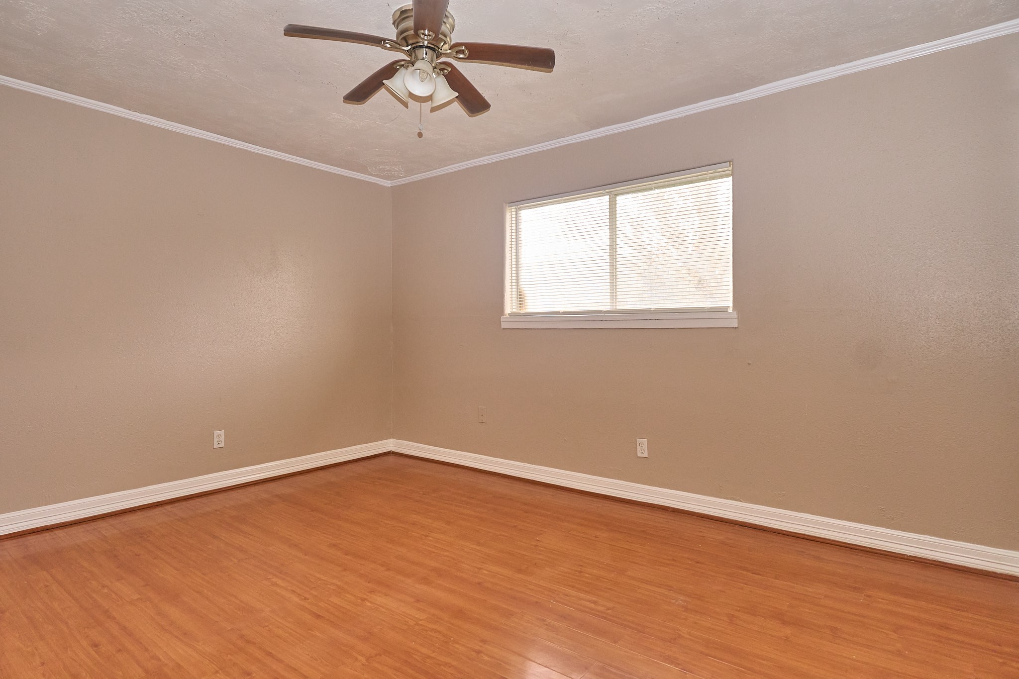 15829 Ridgeroe Lane Houston, TX 77053 - Photo 11 of 16 wooden floor in an empty room with a window