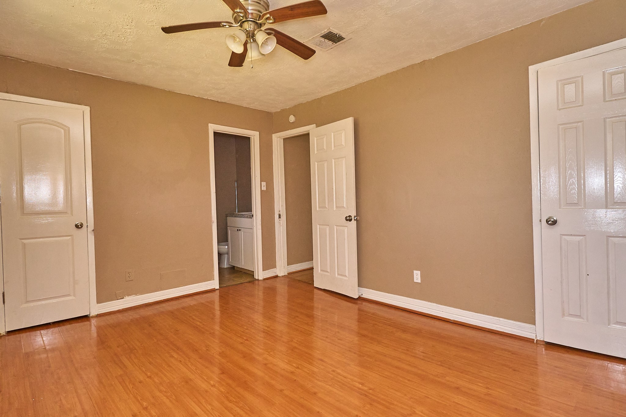 15829 Ridgeroe Lane Houston, TX 77053 - Photo 12 of 16 a view of an empty room with wooden floor