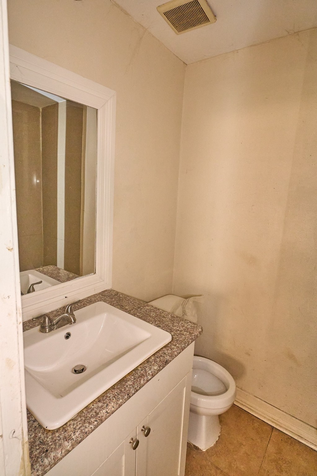 15829 Ridgeroe Lane Houston, TX 77053 - Photo 14 of 16 a bathroom with a granite countertop sink and a toilet