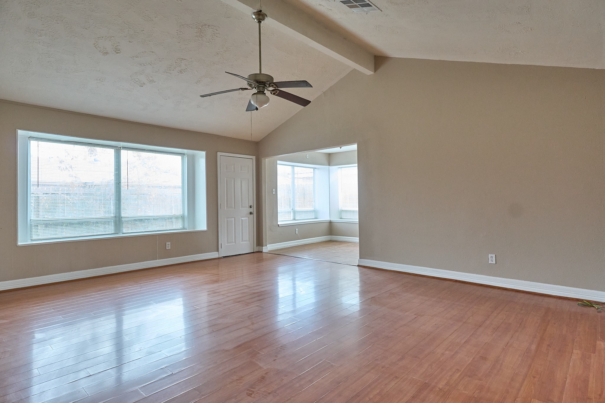 15829 Ridgeroe Lane Houston, TX 77053 - Photo 3 of 16 wooden floor in an empty room with a window